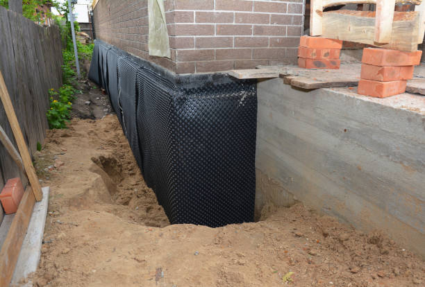 Happy homeowners after waterproofing job in Suring